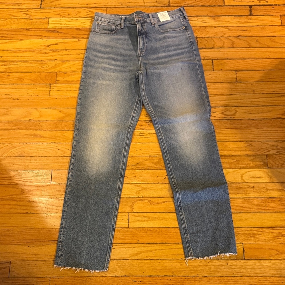 J. Crew Women’s Straight Jeans in Faded Blue with a frayed hem.